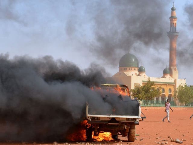 Charlie Hebdo protests: Five dead as churches and French flags burn in ...