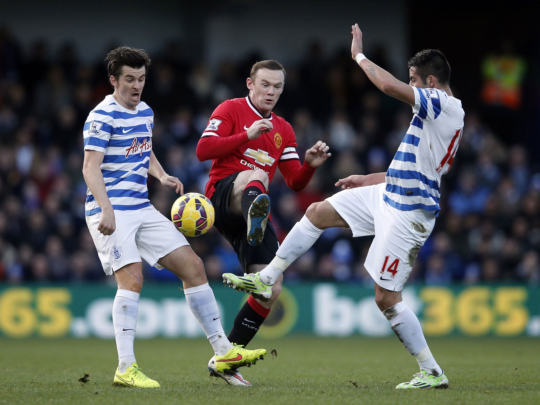 Wayne Rooney jostles with Joey Barton and Mauricio Isla