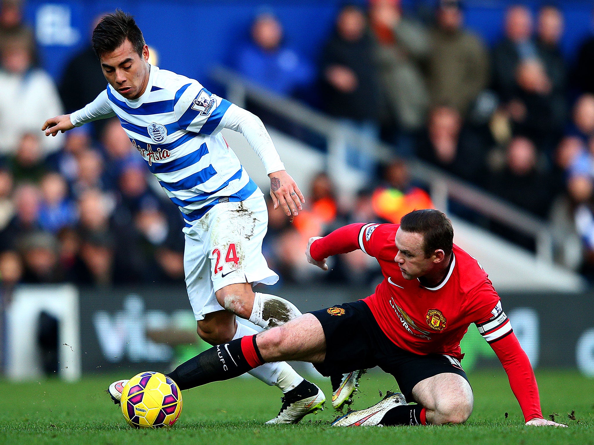 Wayne Rooney tackles Eduardo Vargas