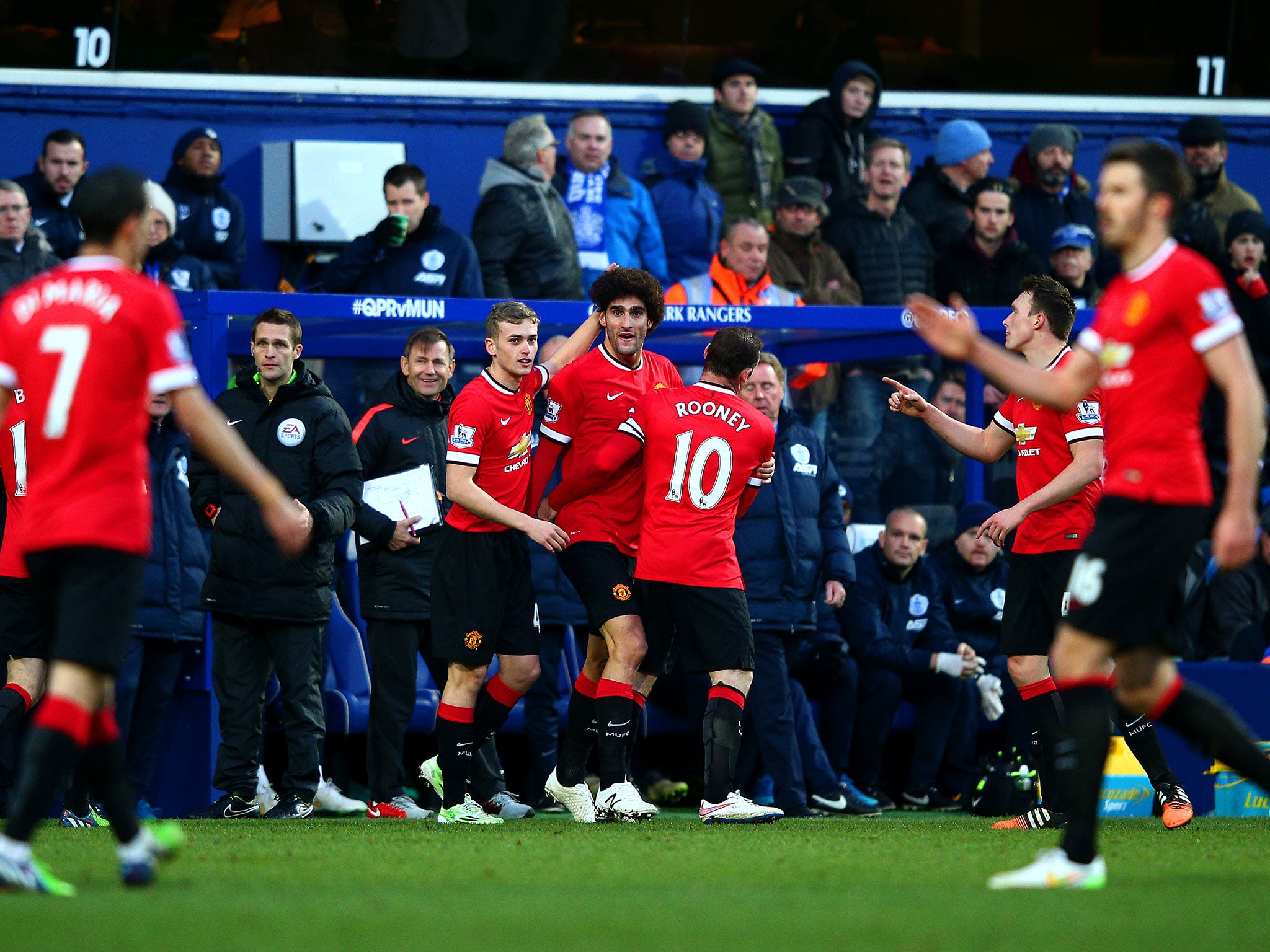 Marouane Fellaini celebrates with his Manchester United team-mates