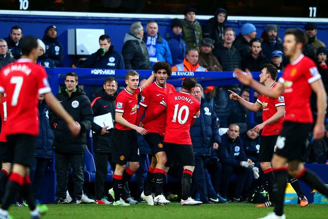 Marouane Fellaini celebrates with his Manchester United team-mates