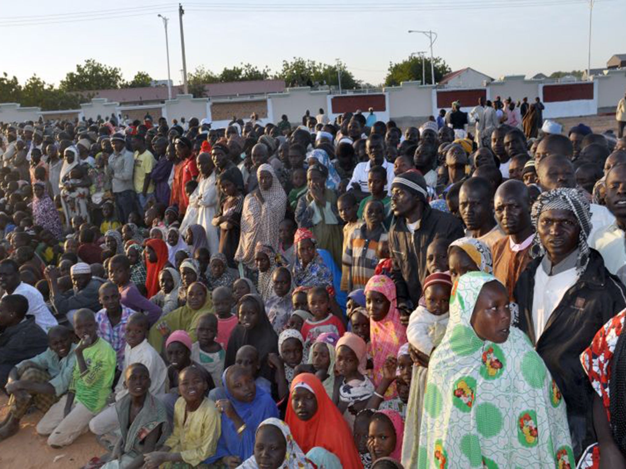 Displaced people from Baga listen to Goodluck Jonathan after the Boko Haram killings (AFP/Getty)