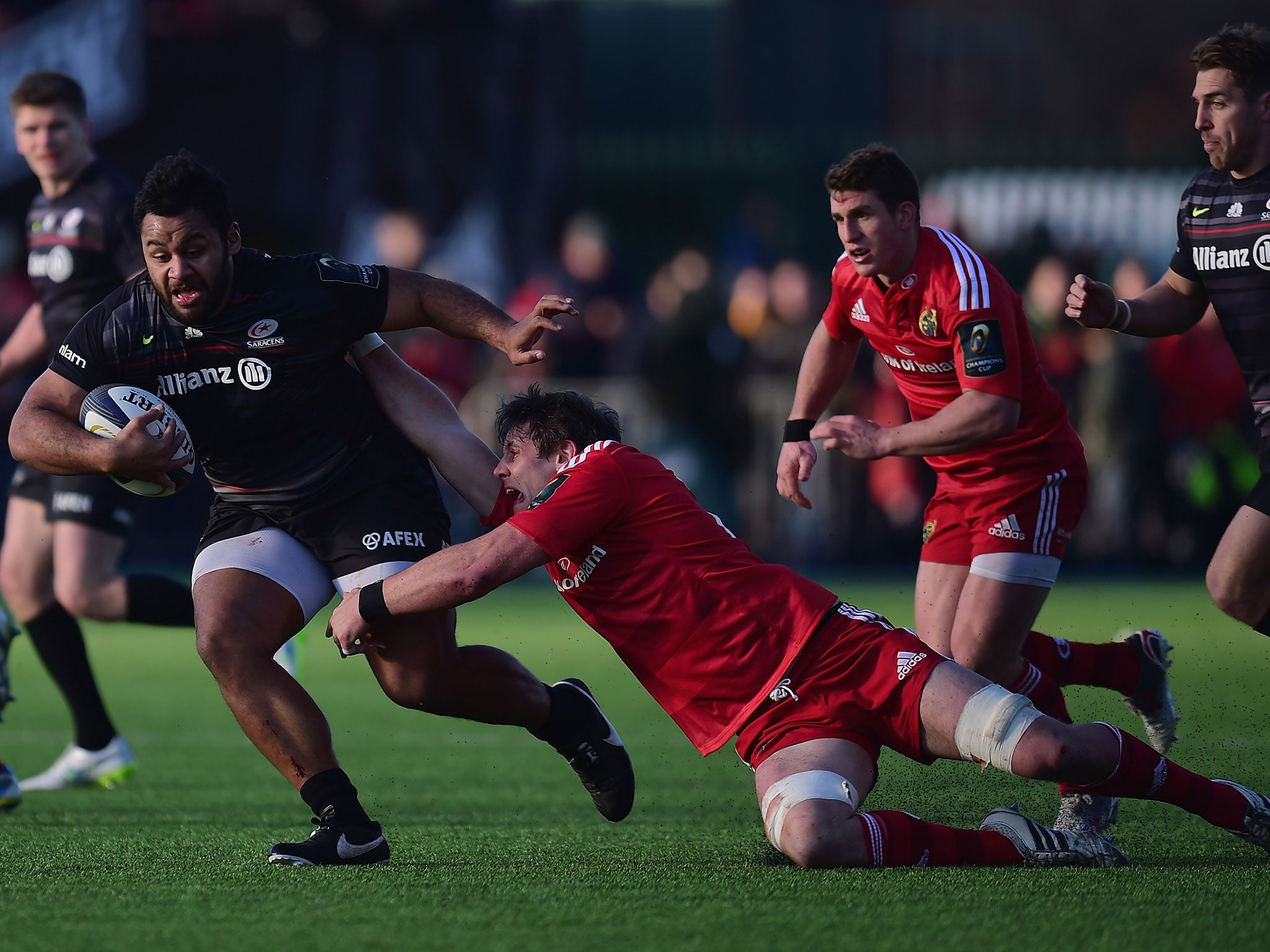 Billy Vunipola evades the clutches of Dave Foley