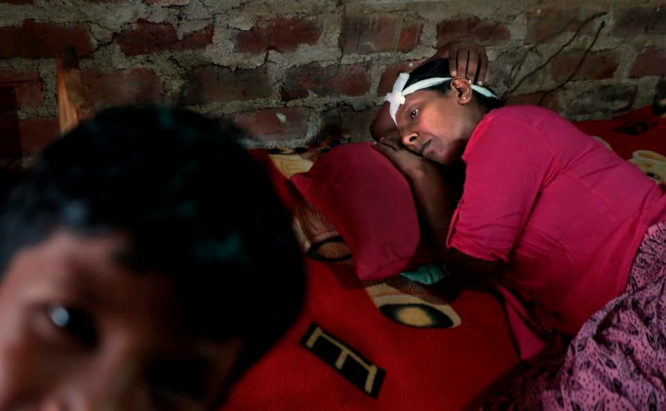 July 24, 2014: V.G. Karunawathie, a patient suffering from a chronic kidney disease of unknown etiology, rests after returning home from a dialysis session at a nearby hospital.