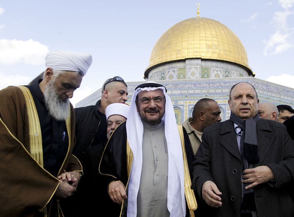Saudi Arabia's Iyad Madani, the Secretary-General of the 57-nation Organisation of Islamic Cooperation, stands in front of the Dome of the Rock shrine in Jerusalem