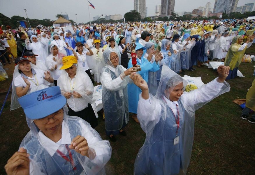 Catholics sung songs and danced before Mass commenced