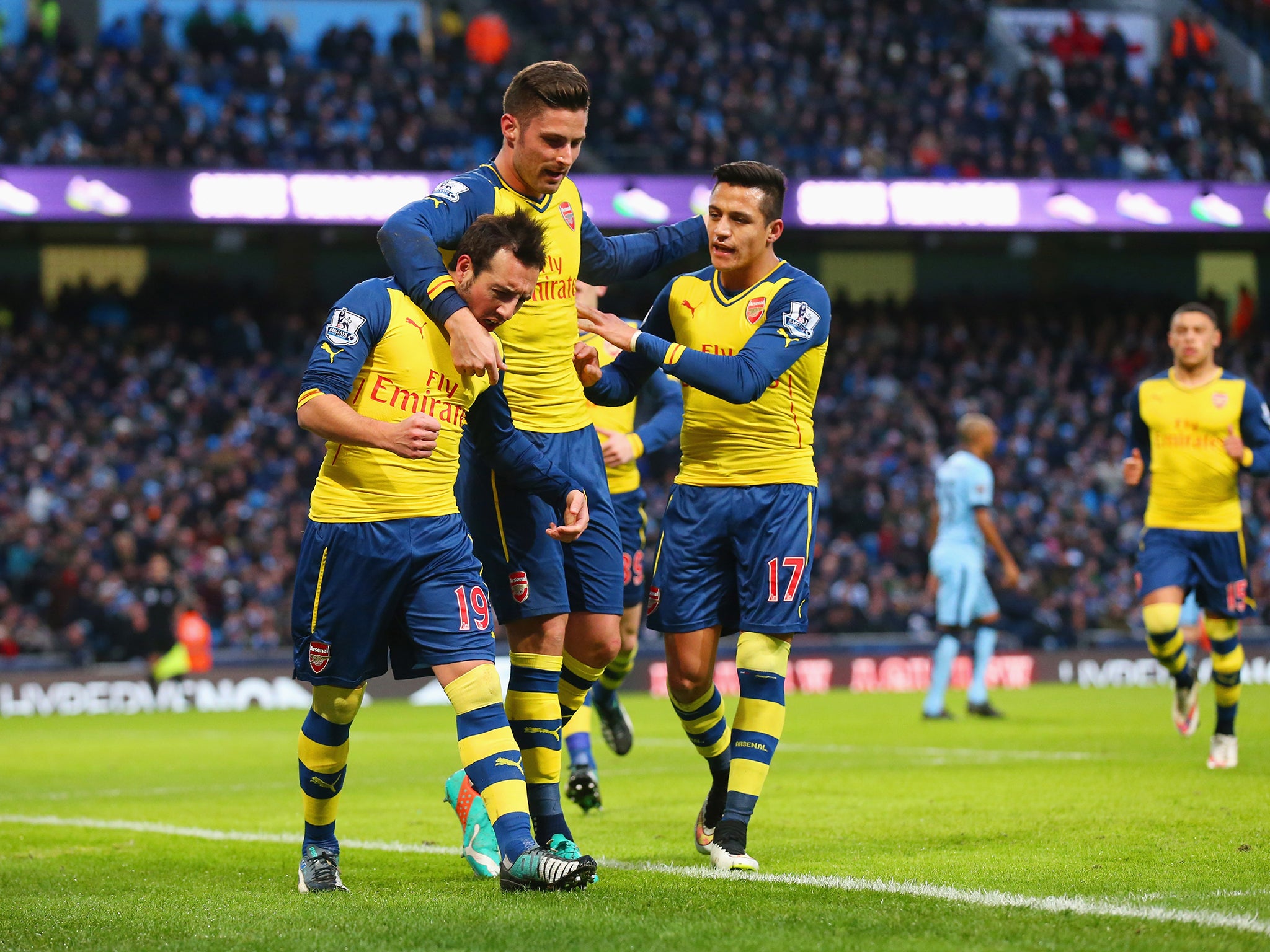 Alexis Sanchez and Olivier Giroud celebrate with Alexis Sanchez after he puts the Gunners 1-0 with a penalty