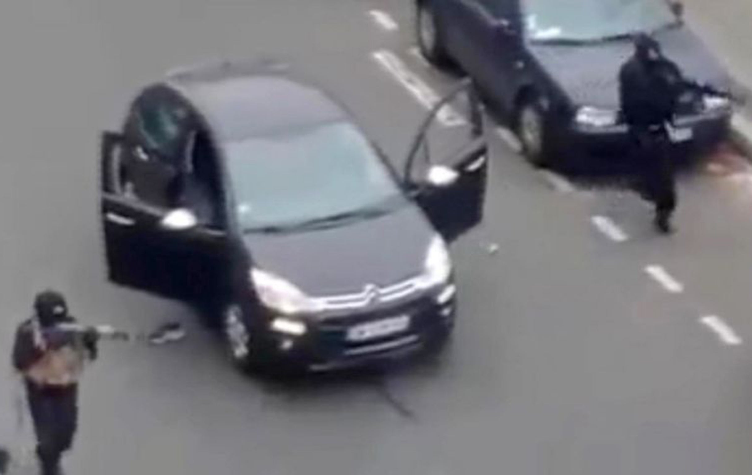 The two brothers stormed the Charlie Hebdo headquarters, opening fire on staff, before executing an already injured police officer as they fled (AP)