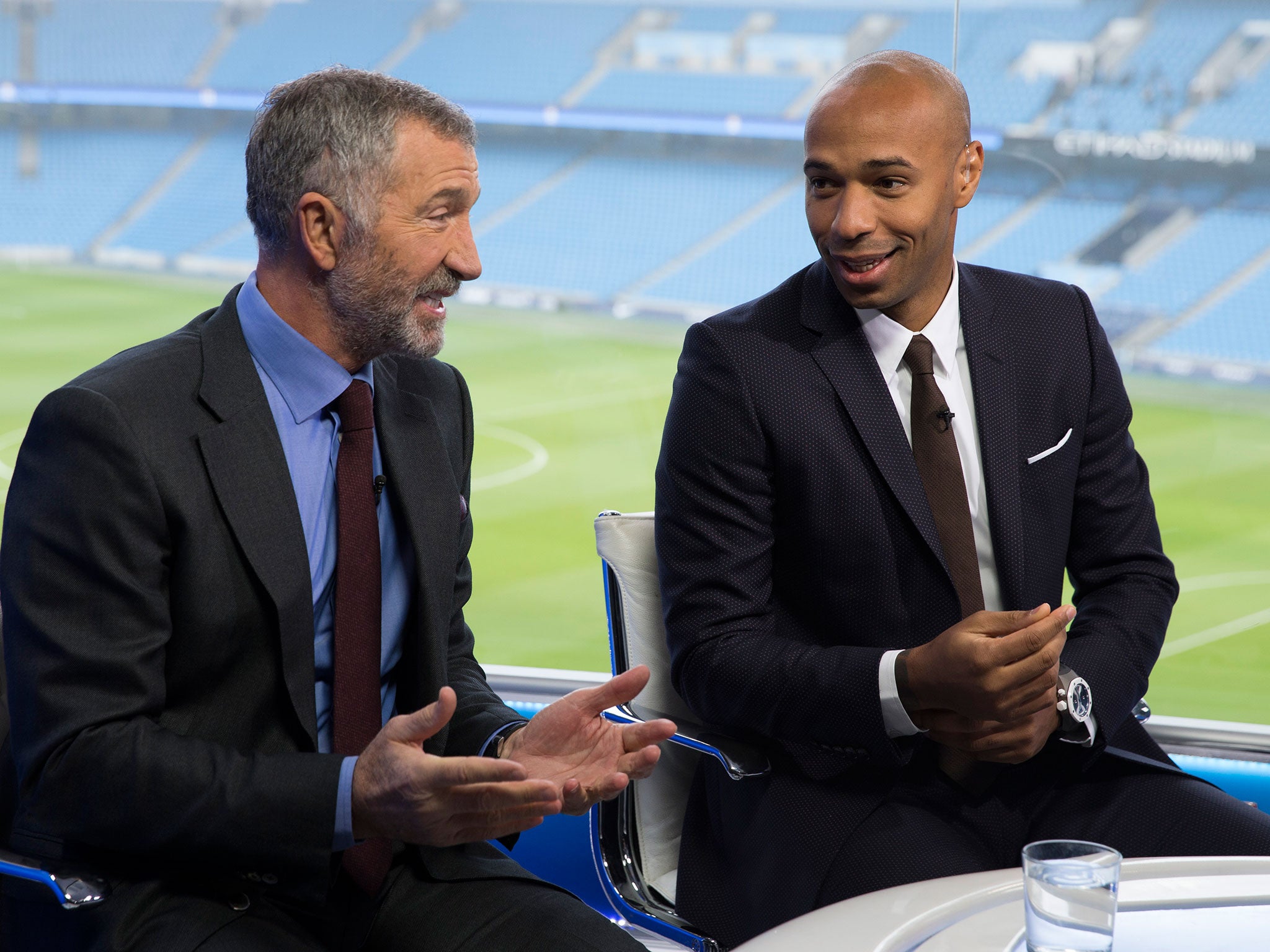 Thierry Henry (right) speaks with Graeme Souness