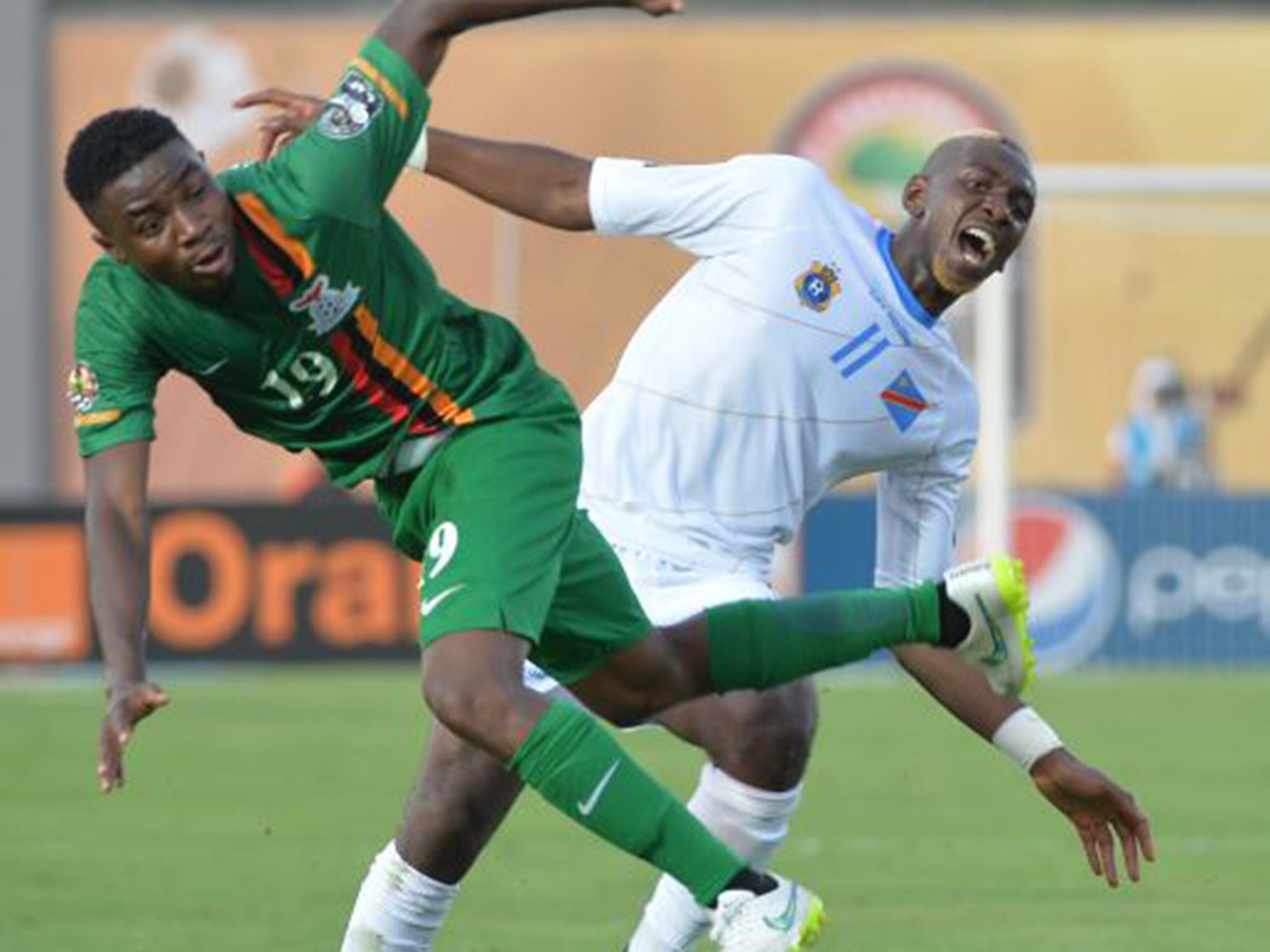 Democratic Republic of Congo's Yannick Bolasie, right, vies with Zambia's Nathan Sinkala during their group B football match on Sunday (AFP/Getty)