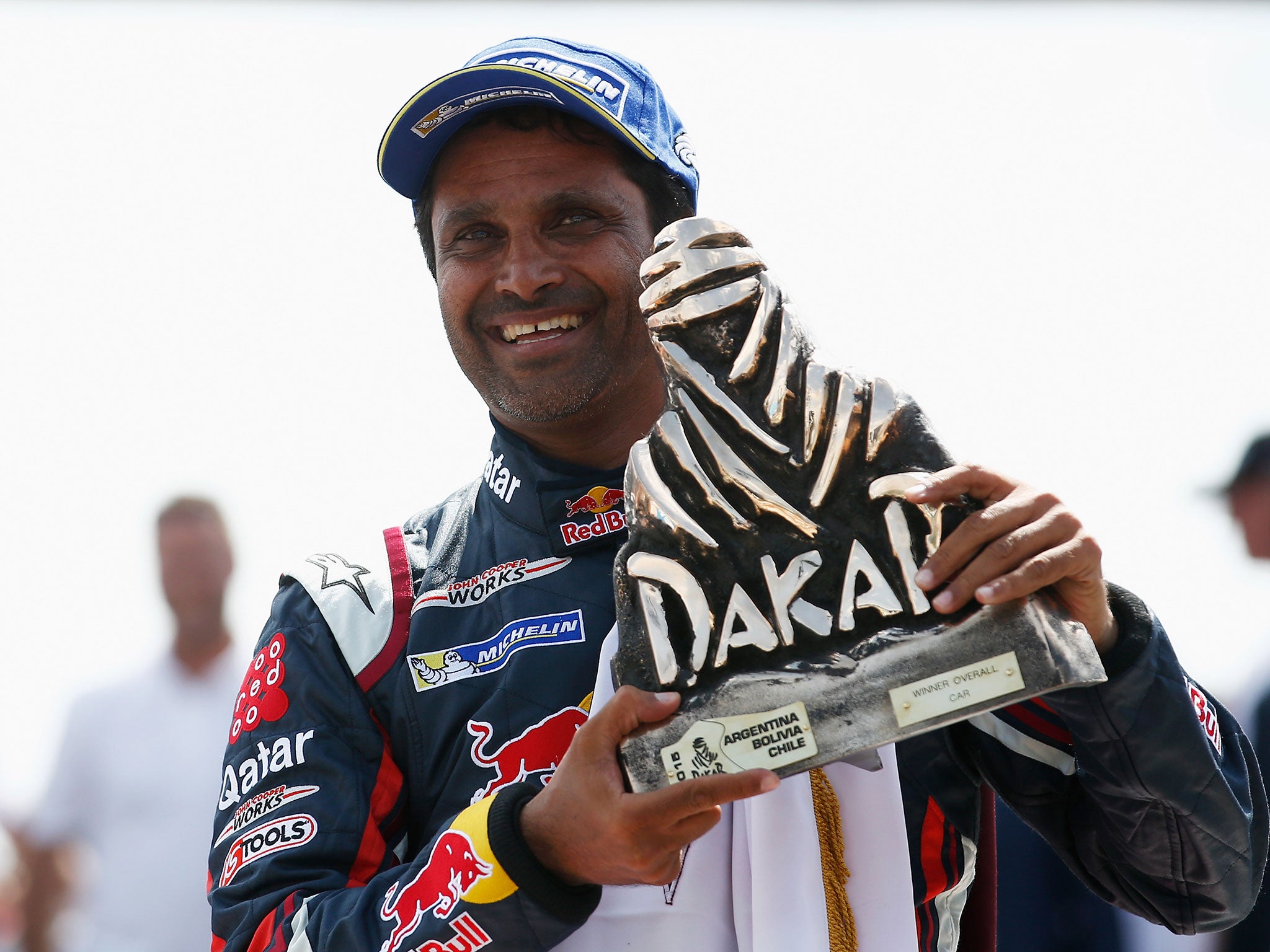 Al-Attiyah celebrates with the Dakar Rally trophy