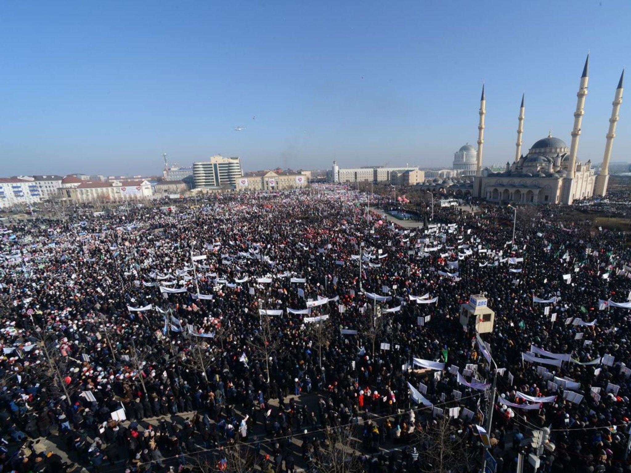 People attend a state-organised rally against the publication of cartoons of the Prophet Mohamed by Charlie Hebdo in the Chechen capital Grozny on 19 January