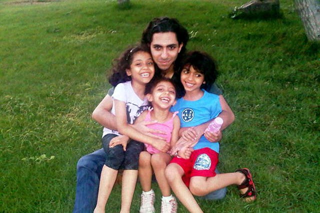 Jailed blogger Raif Badawi, pictured with his children