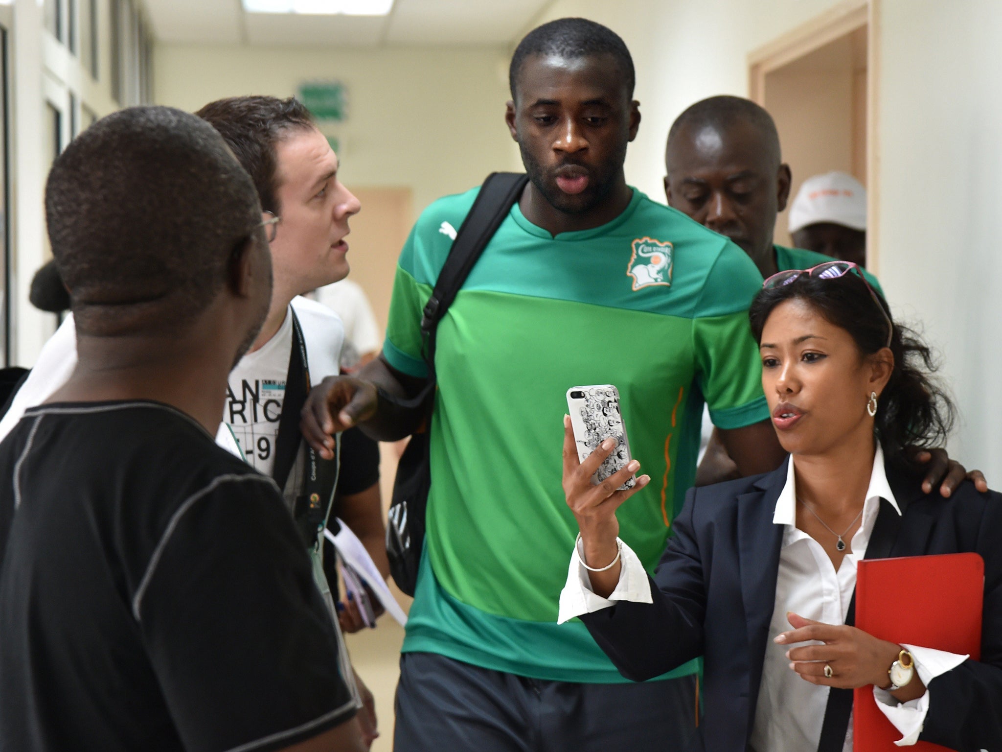 A fan takes a picture with Ivory Coast's midfielder Yaya Toure at Malabo stadium