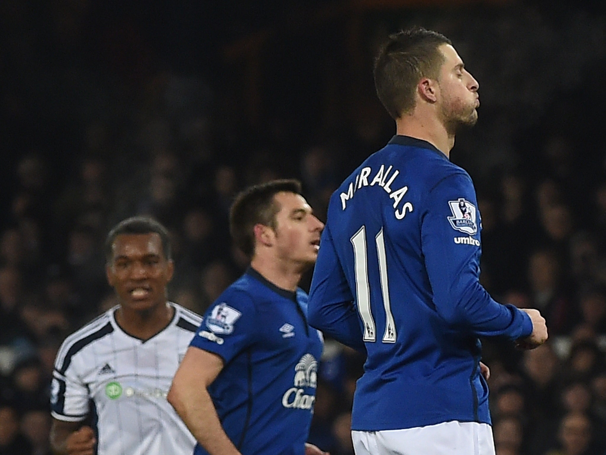 Kevin Mirallas (R) reacts after sending his penalty kick against the post