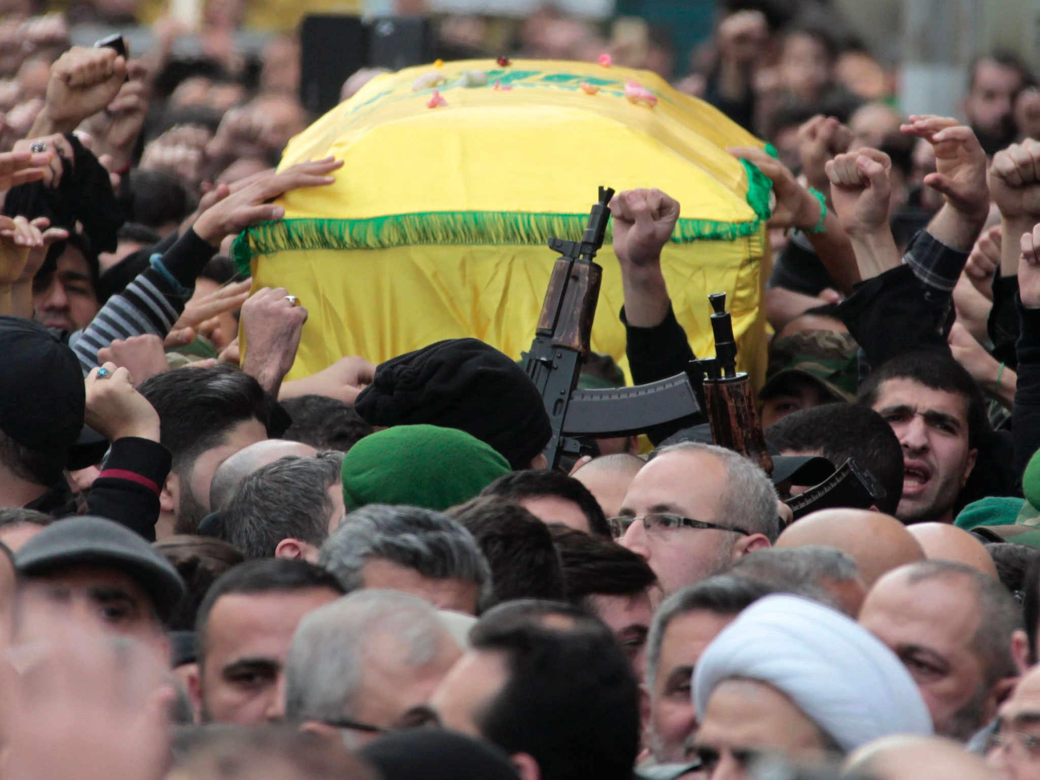 Hezbollah members carry the coffin of Jihad Moughniyah in Beirut