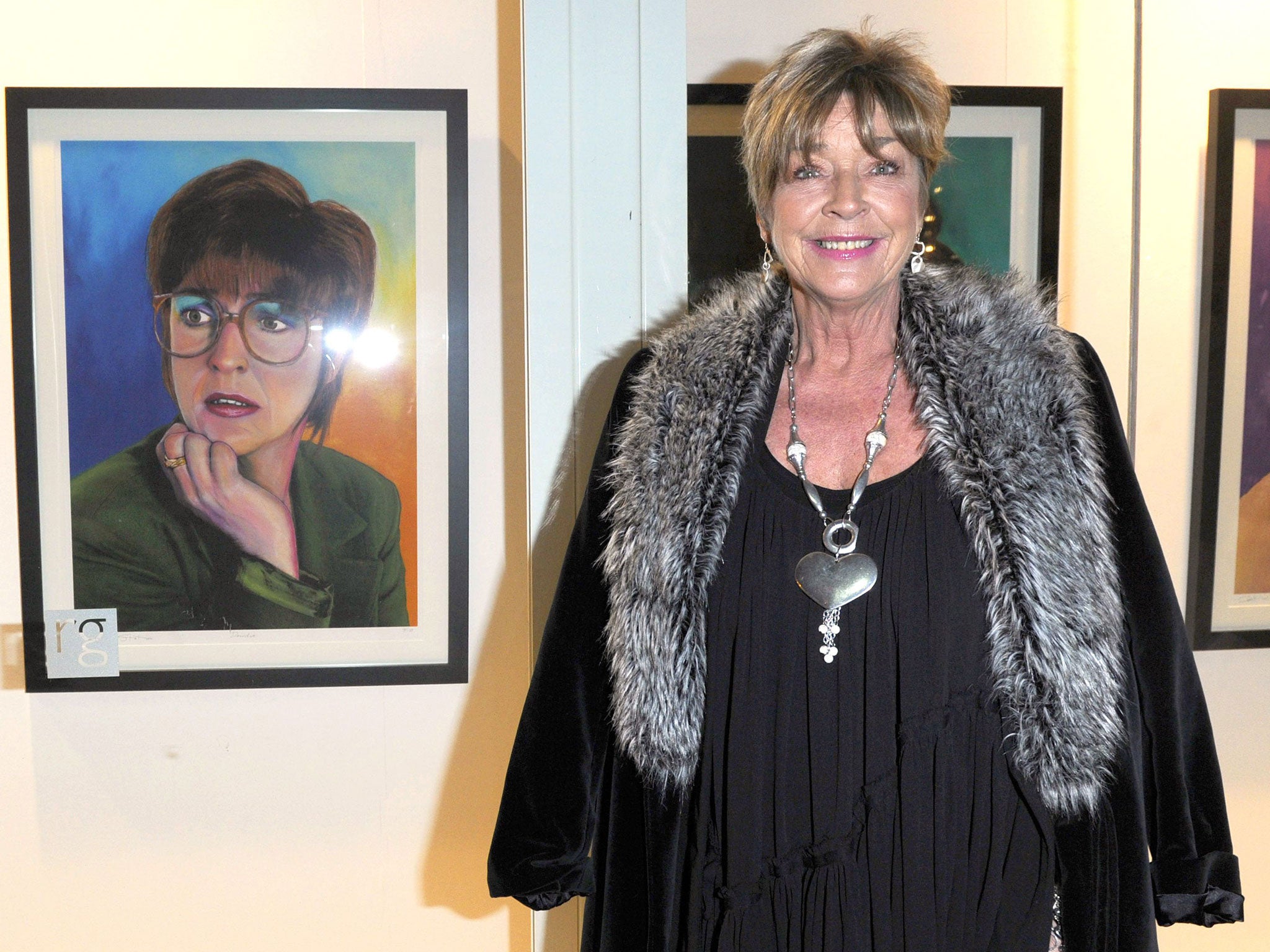 Anne Kirkbride with a portrait of a young Deirdre Barlow at The Richard Goodall Gallery, Manchester, on 2 December 2010