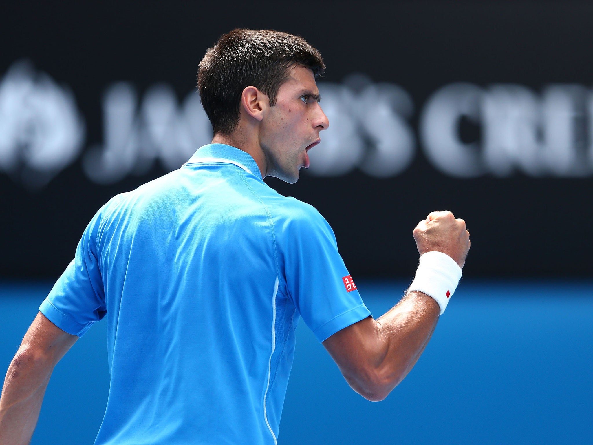 Novak Djokovic celebrates a point won in his first round victory over Aljaz Bedene