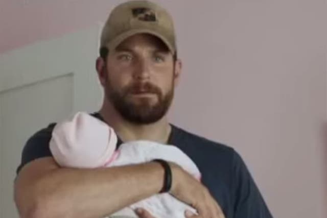 Bradley Cooper holds his fake baby in American Sniper