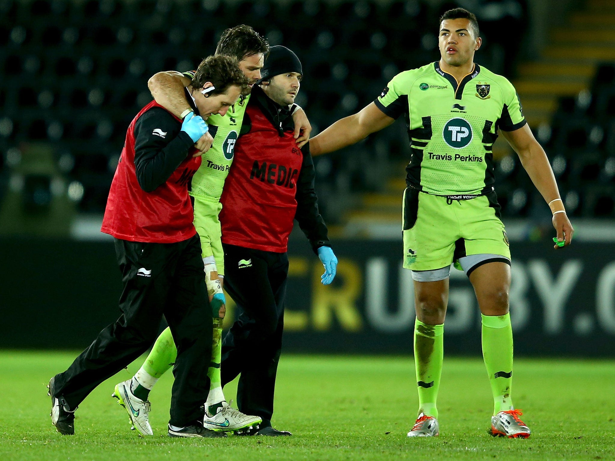 Ben Foden is helped off the field after suffering a knee injury in the 20-9 win over Ospreys