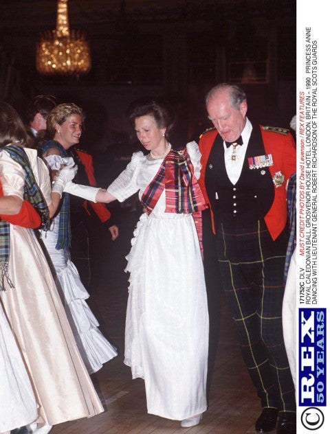 Richardson dances with Princess Anne at the Royal Caledonian Ball at Grosvenor House in London in 1990