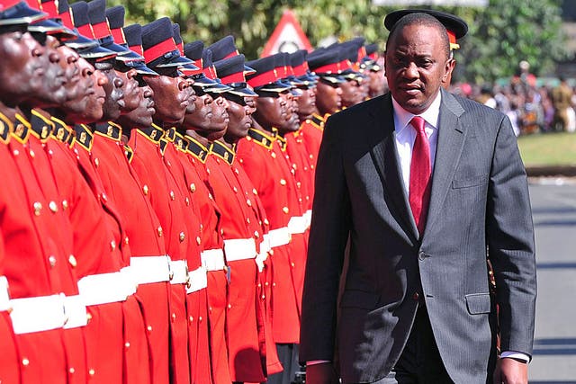 Kenyan President Uhuru Kenyatta receives a guard of honour in Nairobi last year