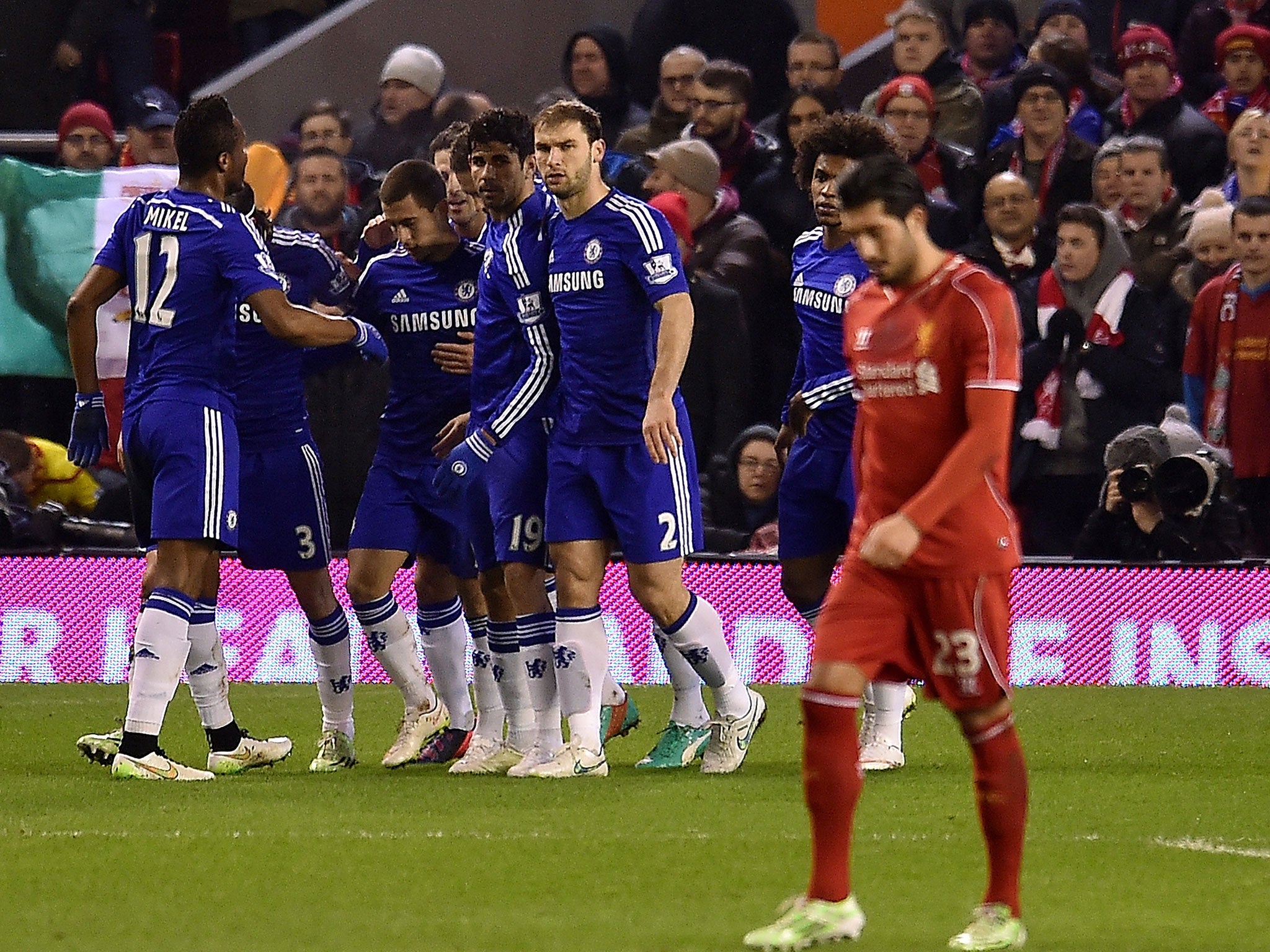 Emre Can (right) reacts after Chelsea score with the penalty