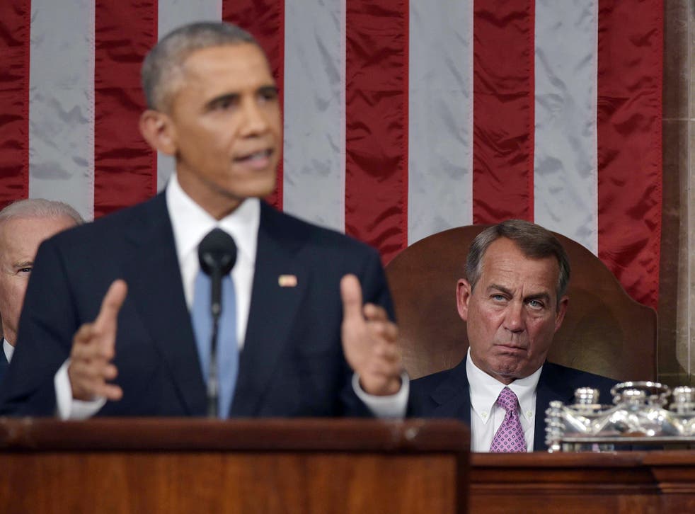 U.S. Speaker of the House John Boehner listens to President Barack Obama deliver the State of the Union address.