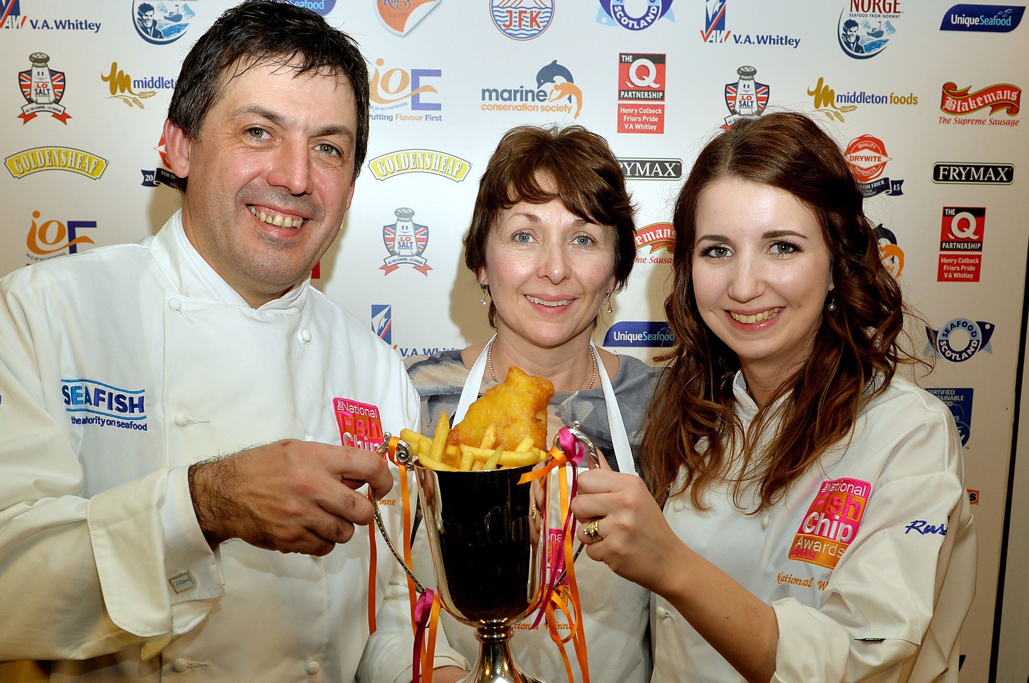 Manager John Gold, owner Valerie Johnson and her daughter Carlyn Johnson from the Fryer of Frankie's celebrate winning the UK's Best Independent Takeaway Fish and Chip Shop of the Year
