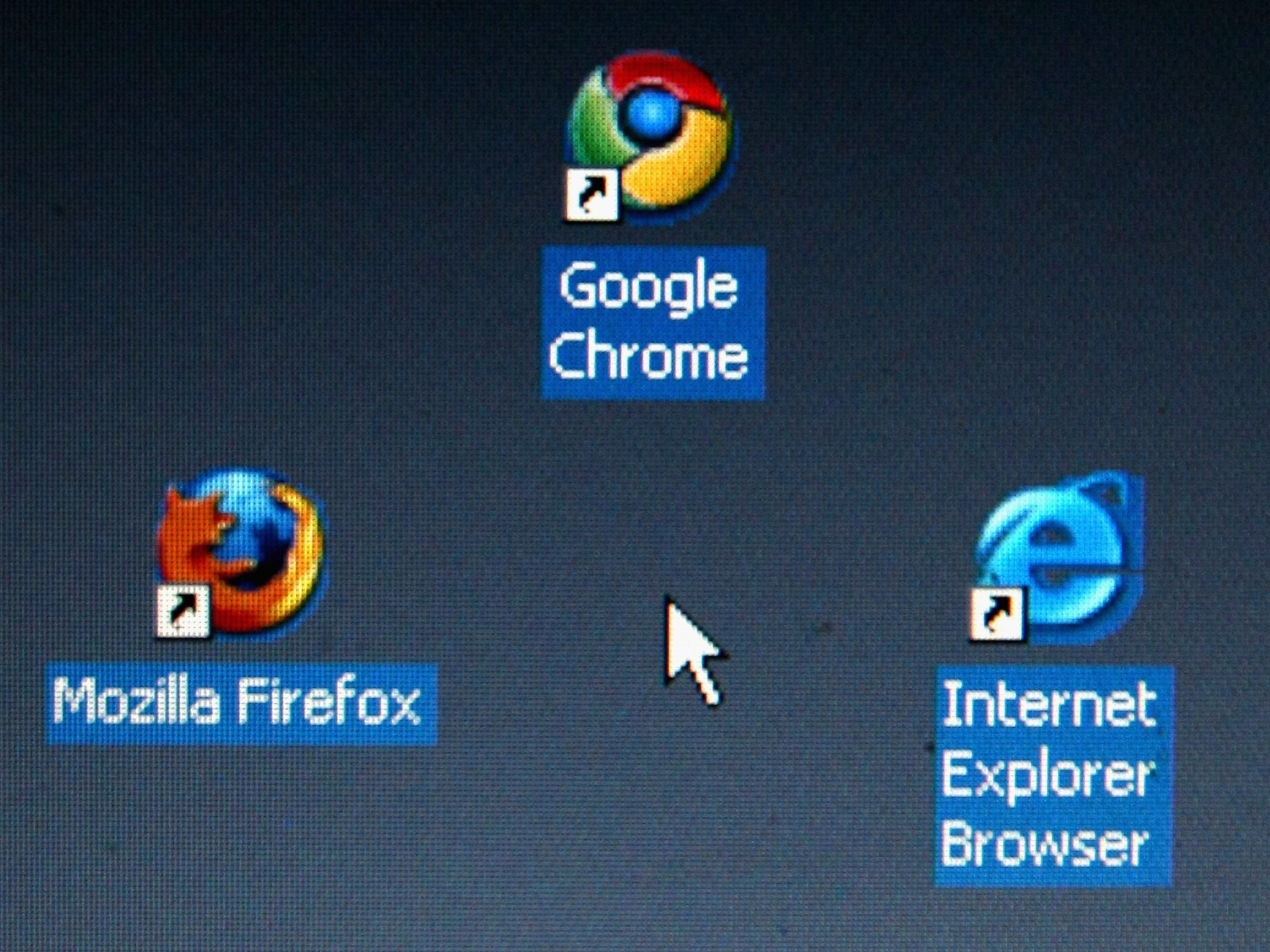 Google's Chrome browser shortcutis displayed next to Mozilla Firefox shortcut and Microsoft's Internet Explorer browser shortcut, on a laptop