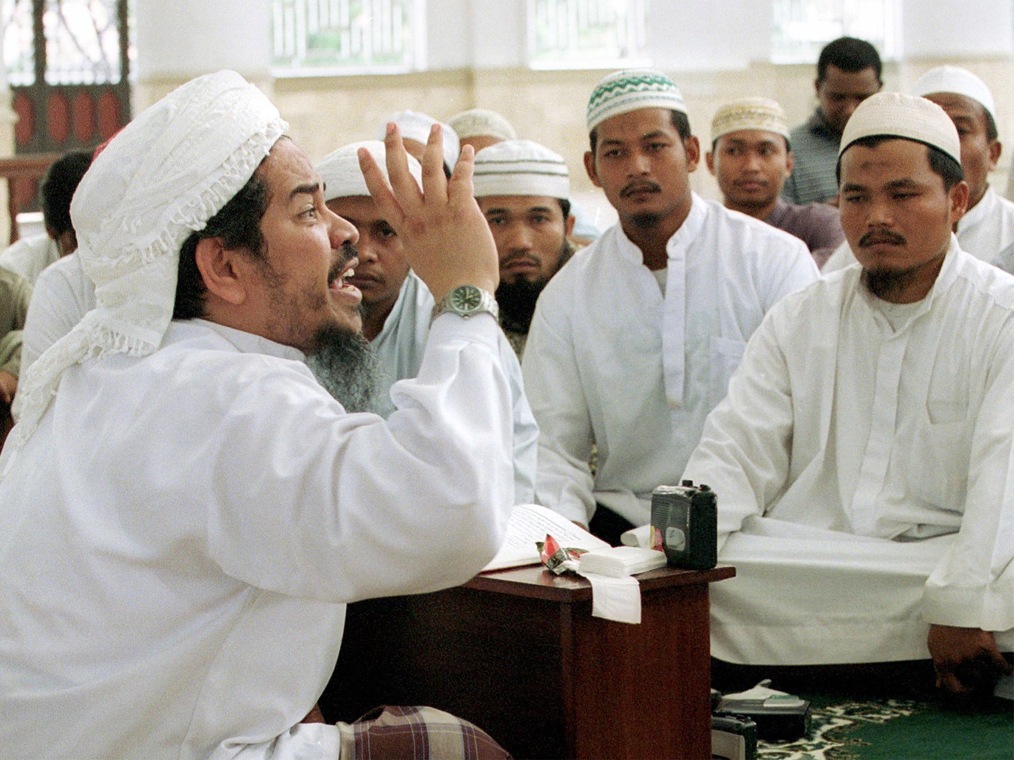Jafar Umar Thalib, commander of the Java-based militant group Laskar Jihad, preaches at a mosque in Aceh, Indonesia, in 2002 (Getty)