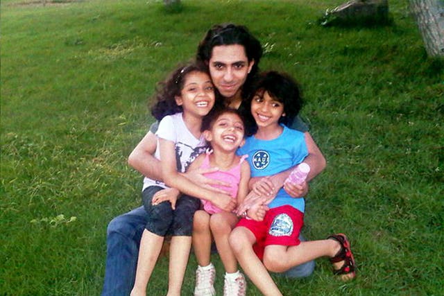 Jailed blogger Raif Badawi, pictured with his children