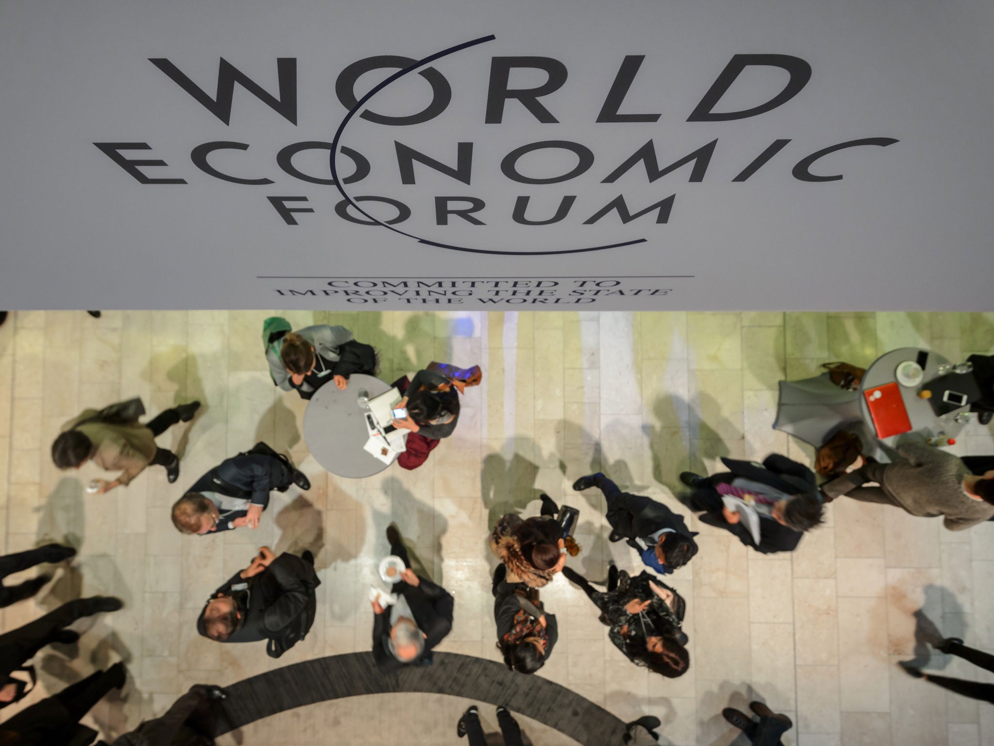 Participants are seen at the Congress Center during the World Economic Forum (WEF) annual meeting on 21 January, 2014, in Davos
