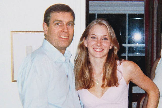 <p>Prince Andrew and the then Virginia Roberts in the infamous photo in Ghislaine Maxwell’s London townhouse </p>