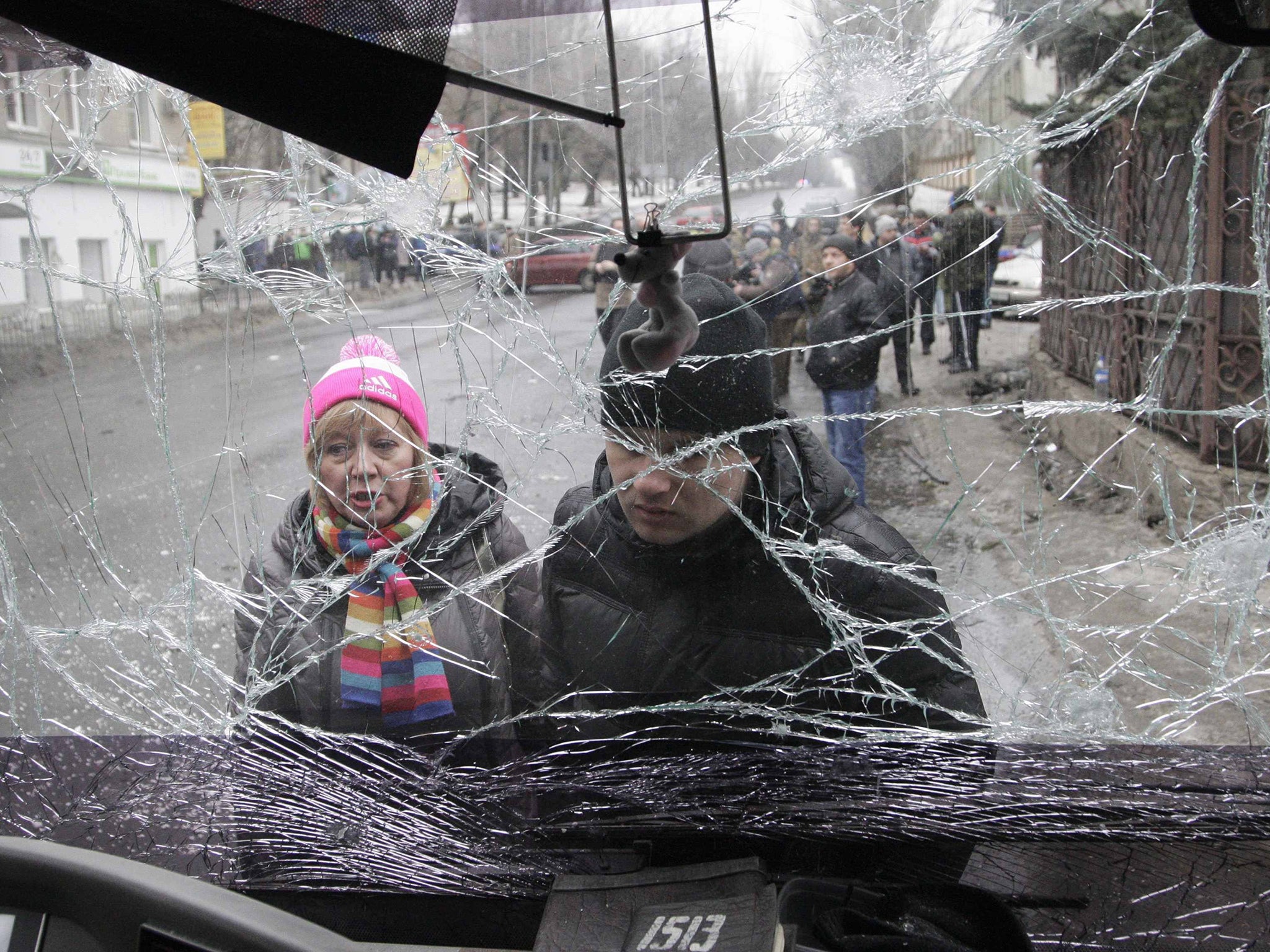 The windshield of the bus hit by a shell or mortar in Donetsk yesterday, when 13 people died