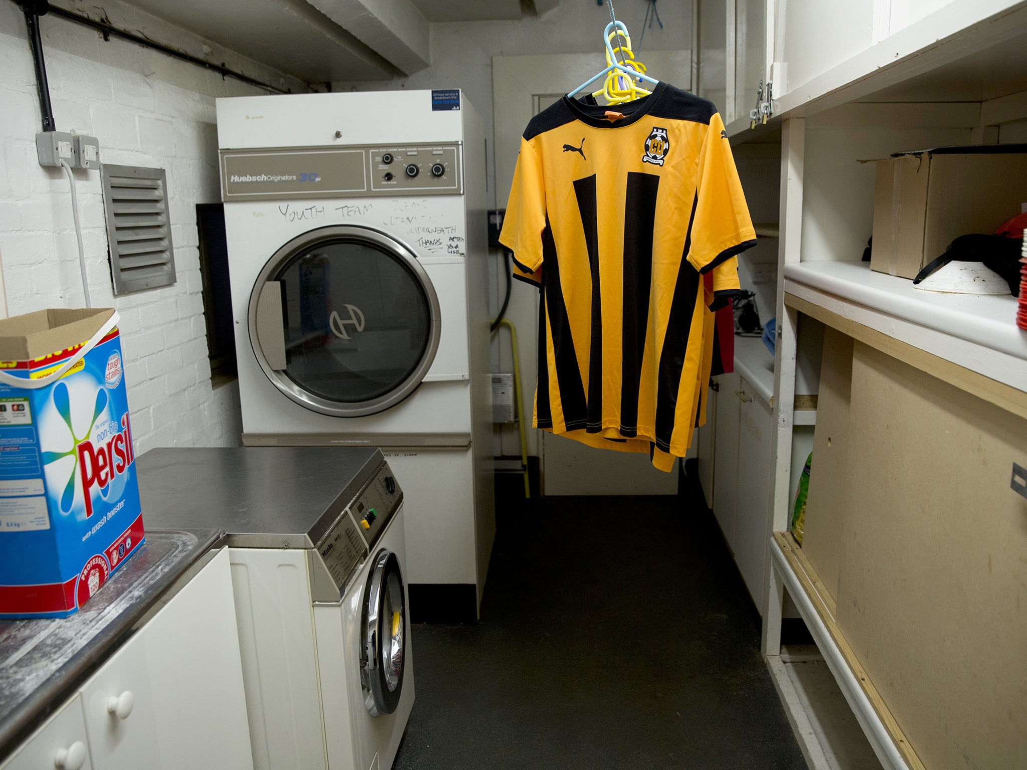 Shirts hang in the laundry room Cambridge United's grounds