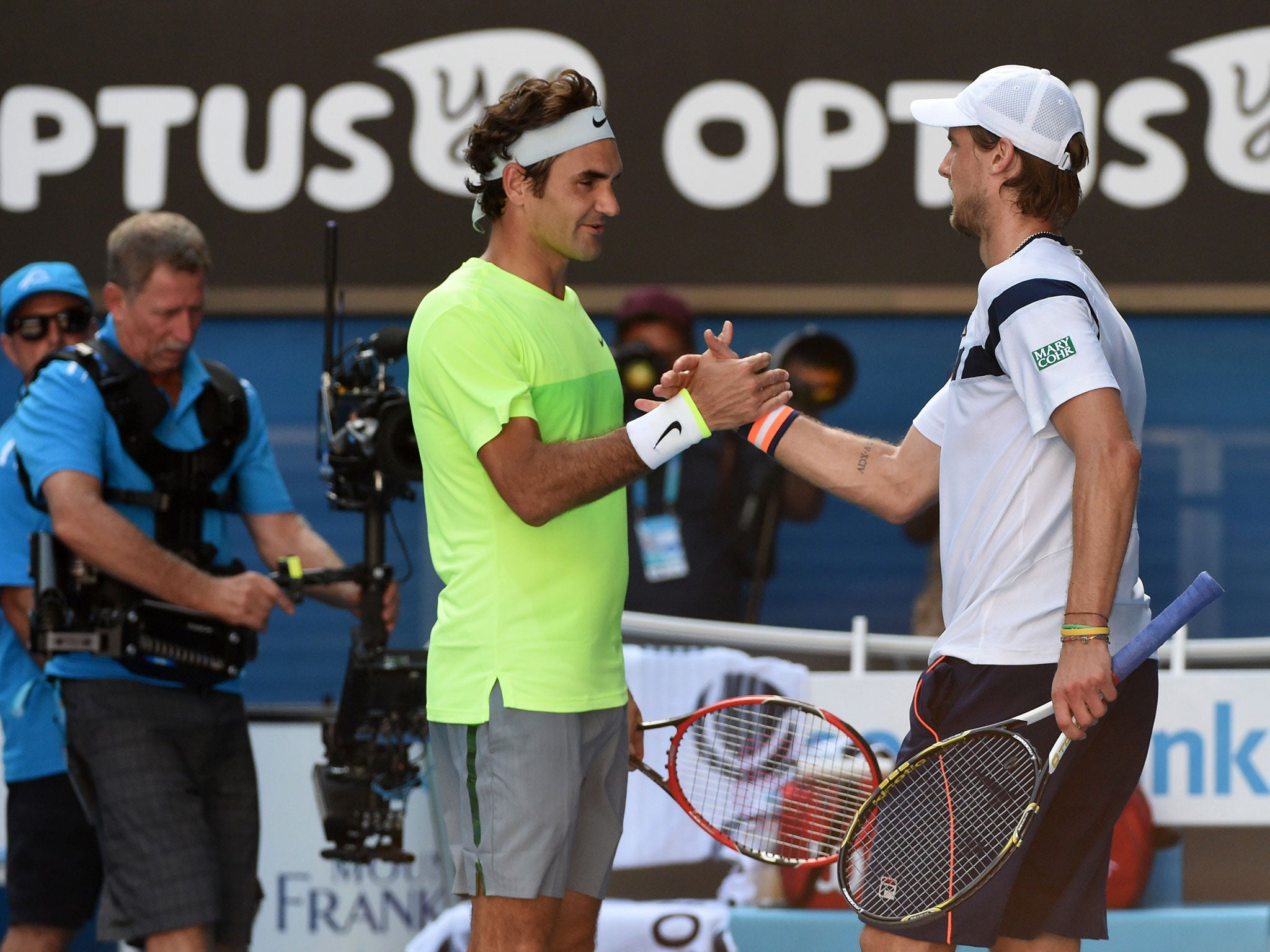 Federer shakes hands with Seppi after his third round elimination