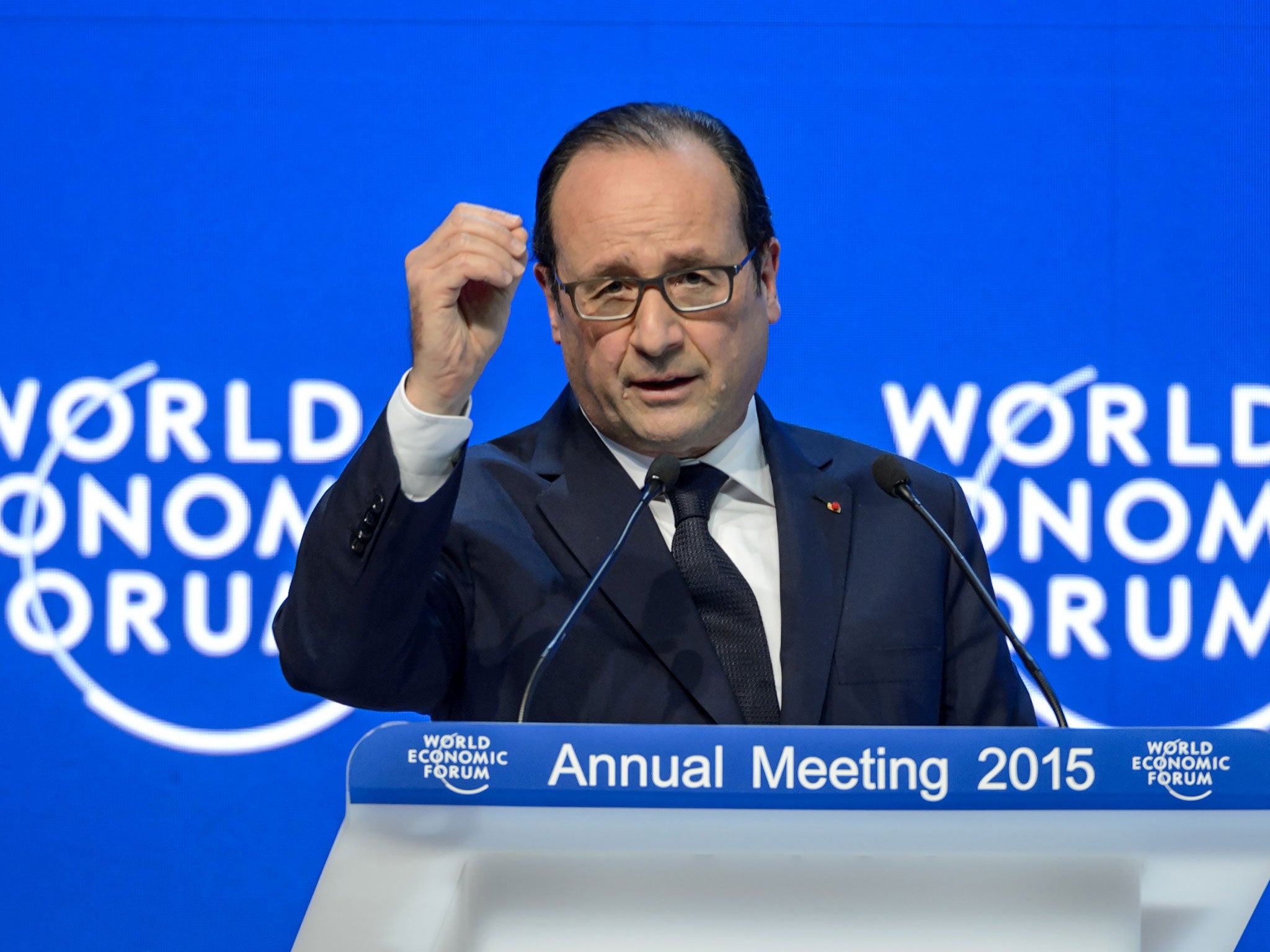 French President Francois Hollande gestures during a speech at the World Economic Forum (WEF) annual meeting on 23 January, 2015, in Davos, Switzerland