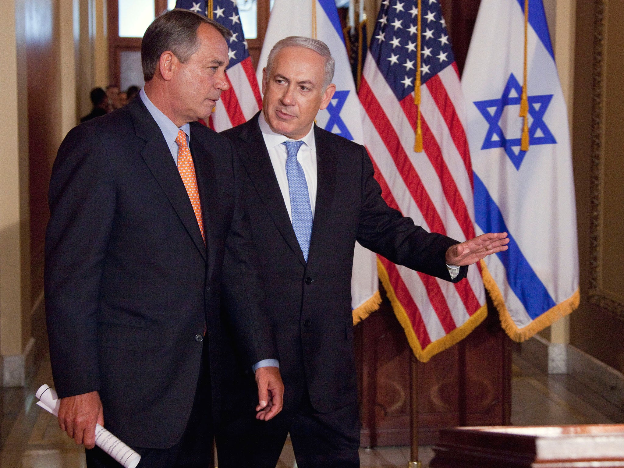 Benjamin Netanyahu and walks with House Speaker John Boehner of Ohio in Washington