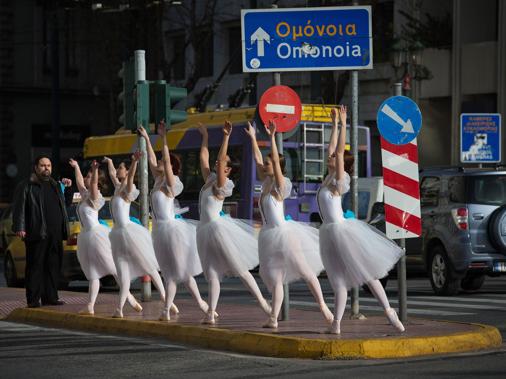 Ballet dancers, performing for a film in Athens, dance in front of the Parliament building ahead of the general election