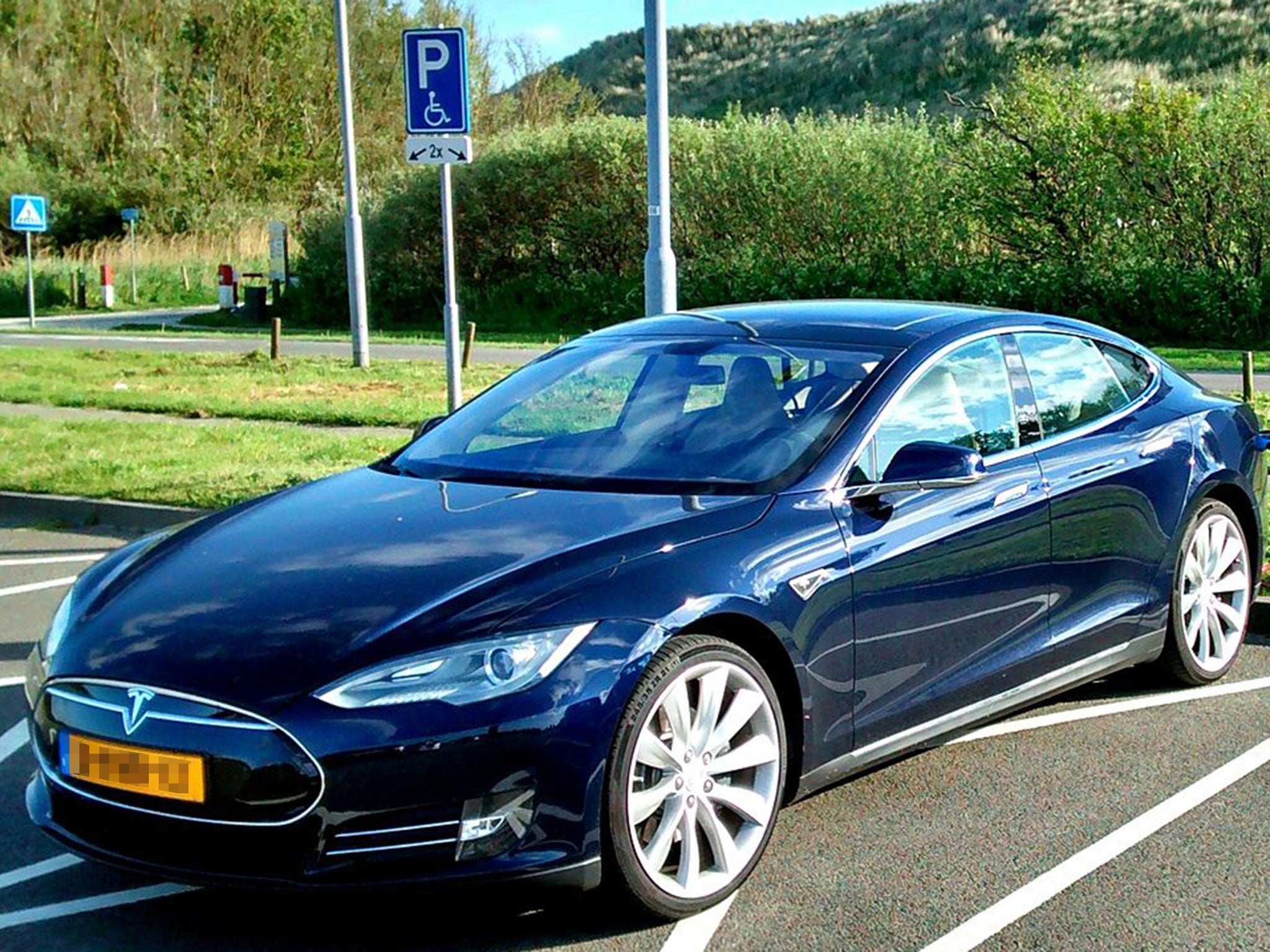 A Blue Tesla Model S, similar to the car Steve Sasman is advertising on Airbnb