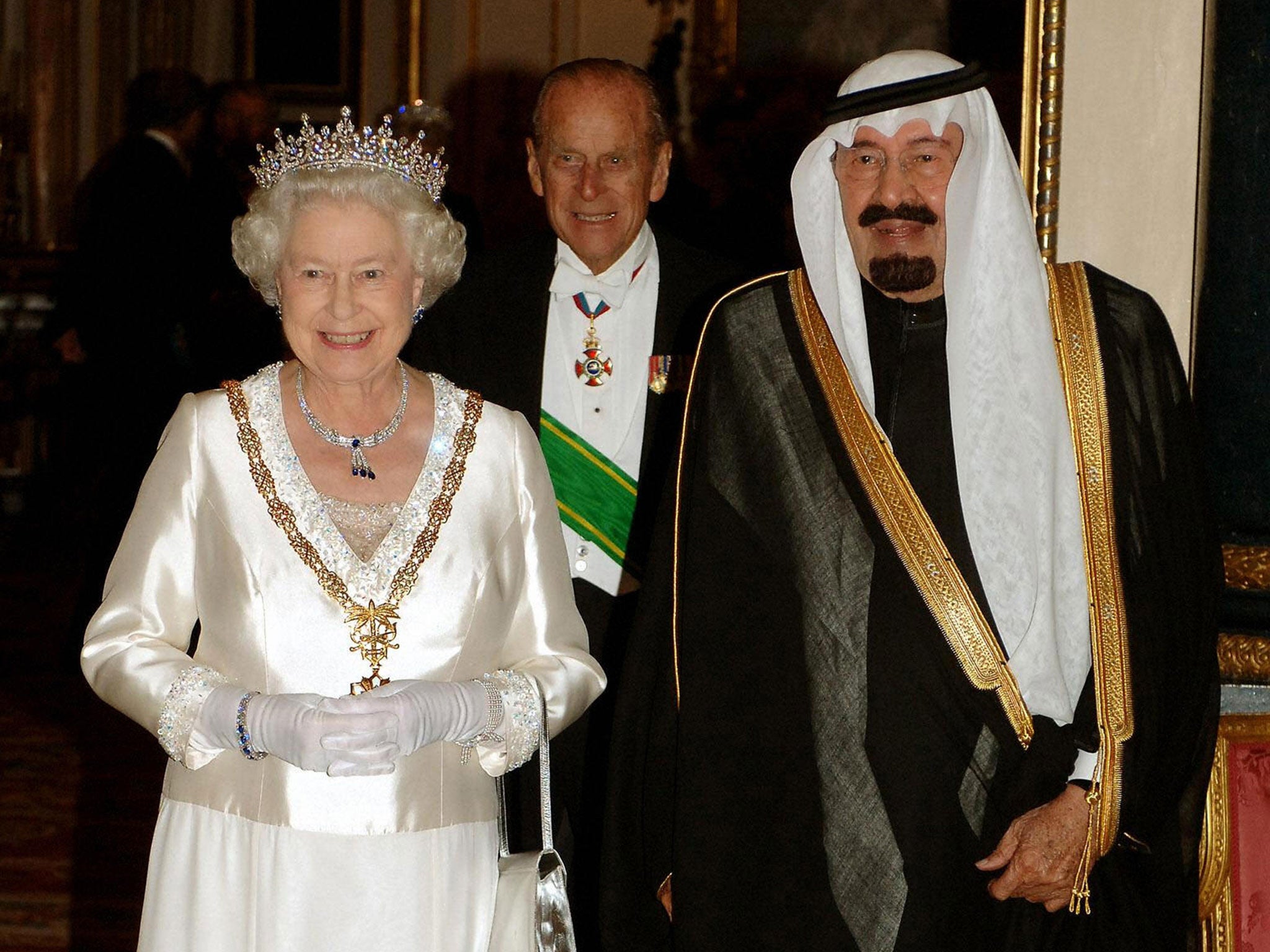 King Abdullah of Saudi Arabia with Queen Elizabeth and the Duke of Edinburgh at a banquet in Buckingham Palace during his 2007 visit