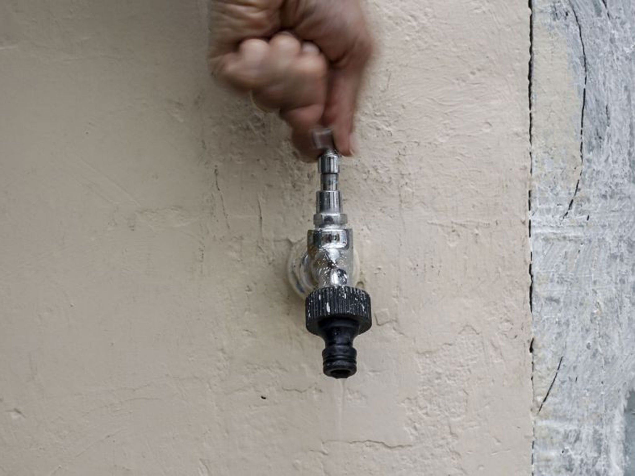 A trickle of water flows from an open tap at a house in Sao Paulo, due to the lack of water in the Brazilian city, on January 22, 2015.