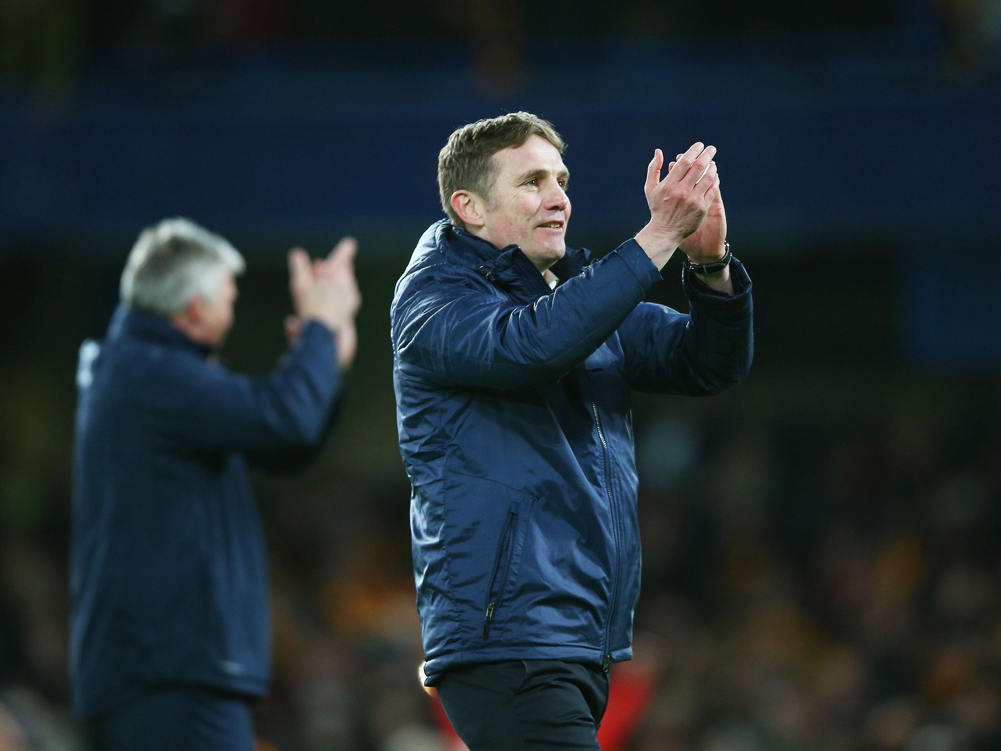 Manager Phil Parkinson applauds the Bradford support