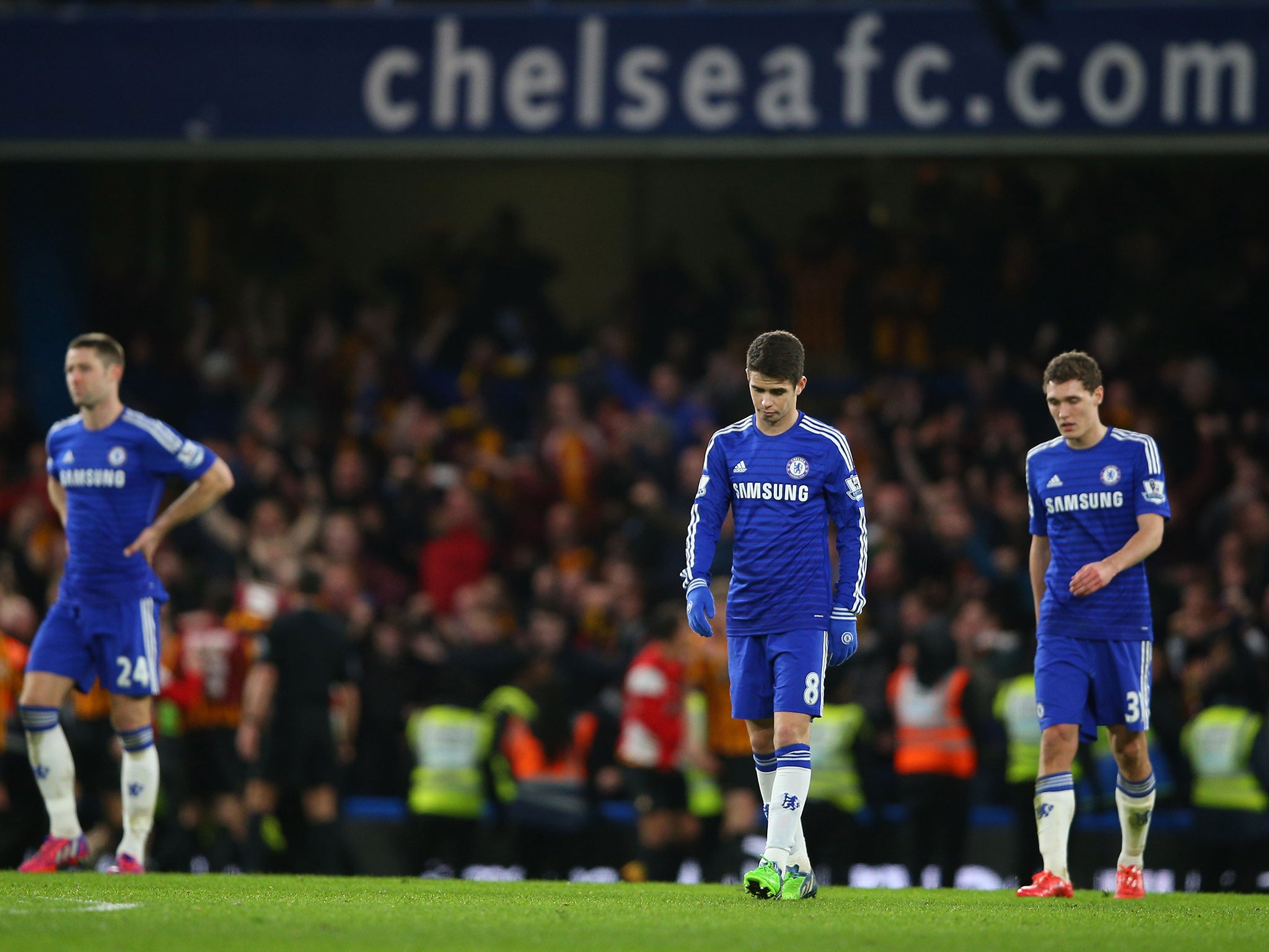 Chelsea players react after conceding at Stamford Bridge