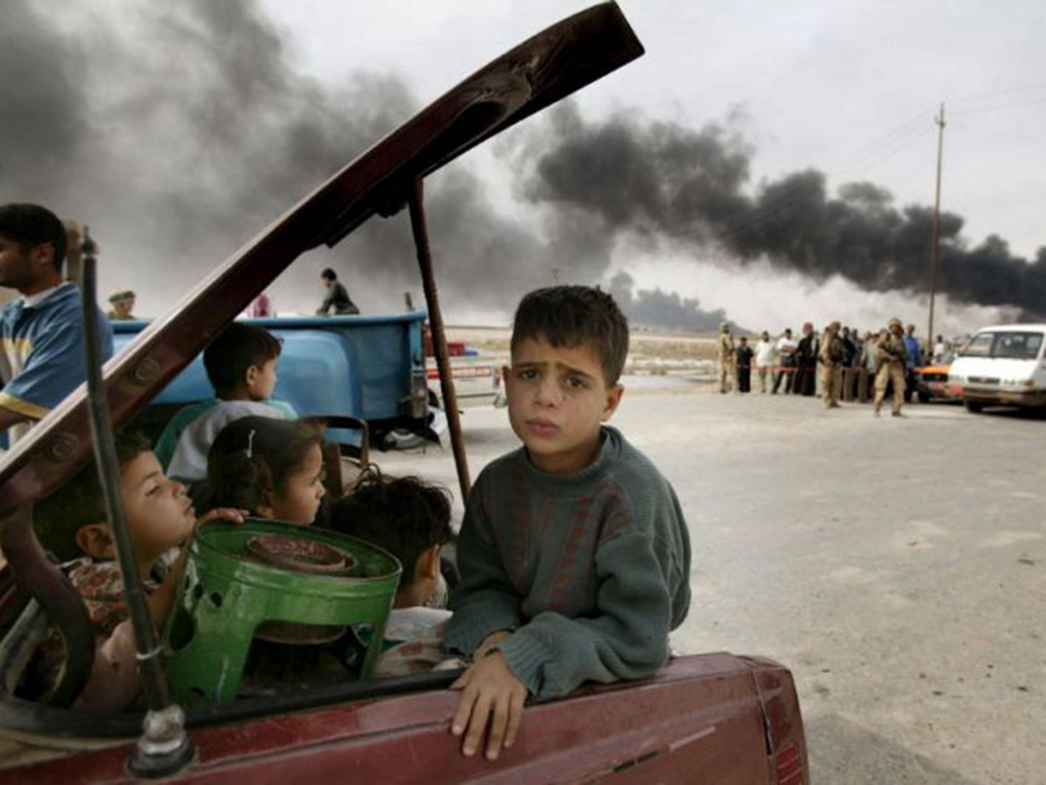 Families escape from Basra in March 2003