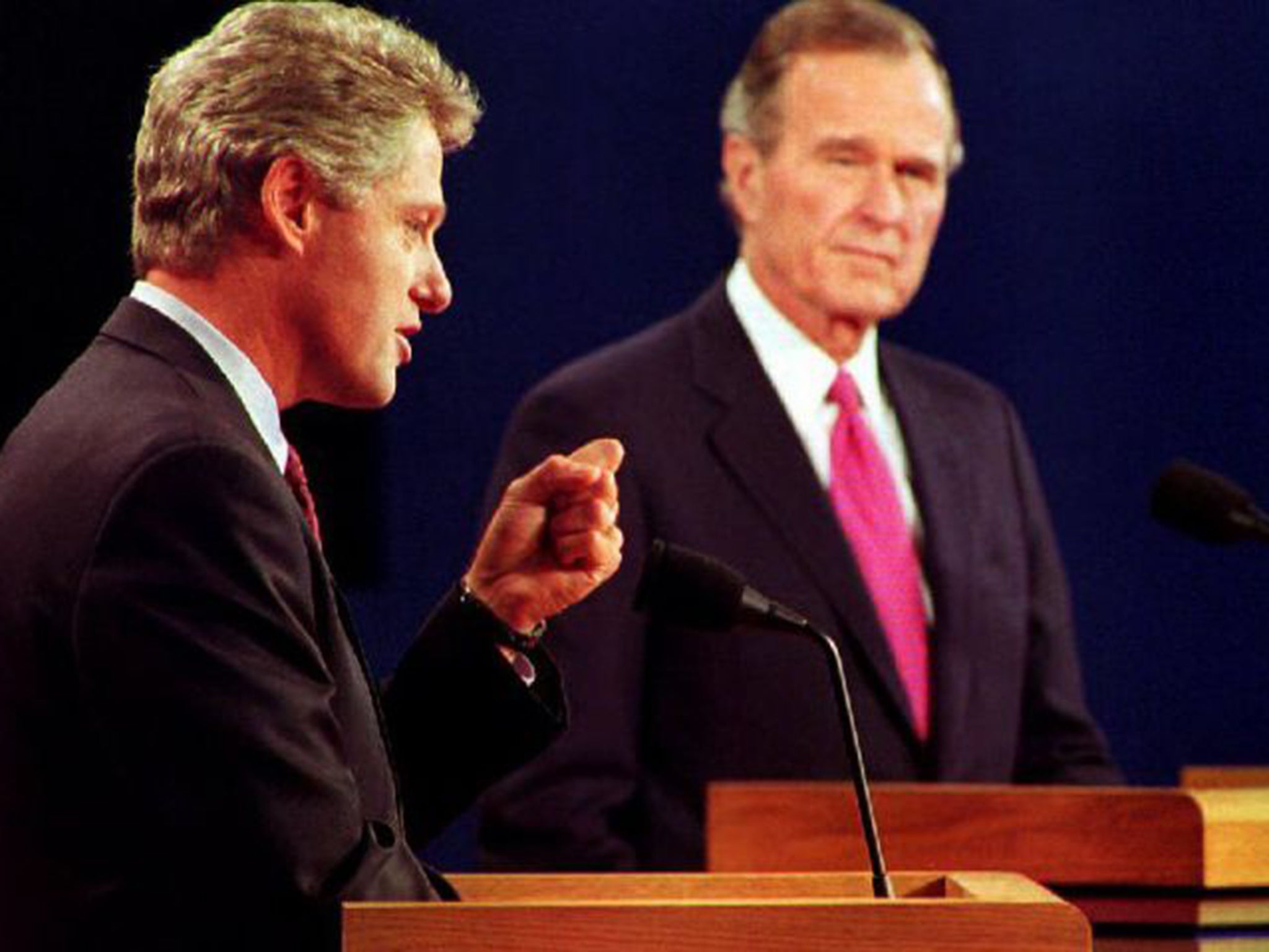 Hillary's husband Bill, left, with George Bush Snr (AFP)