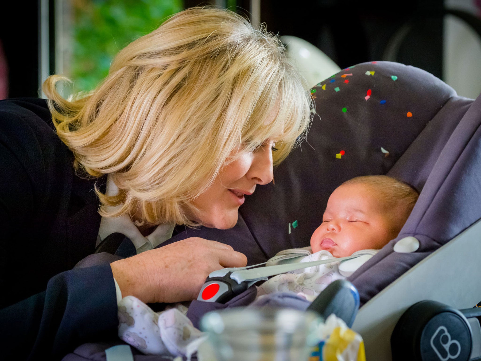 Caroline looks at her baby daughter Flora