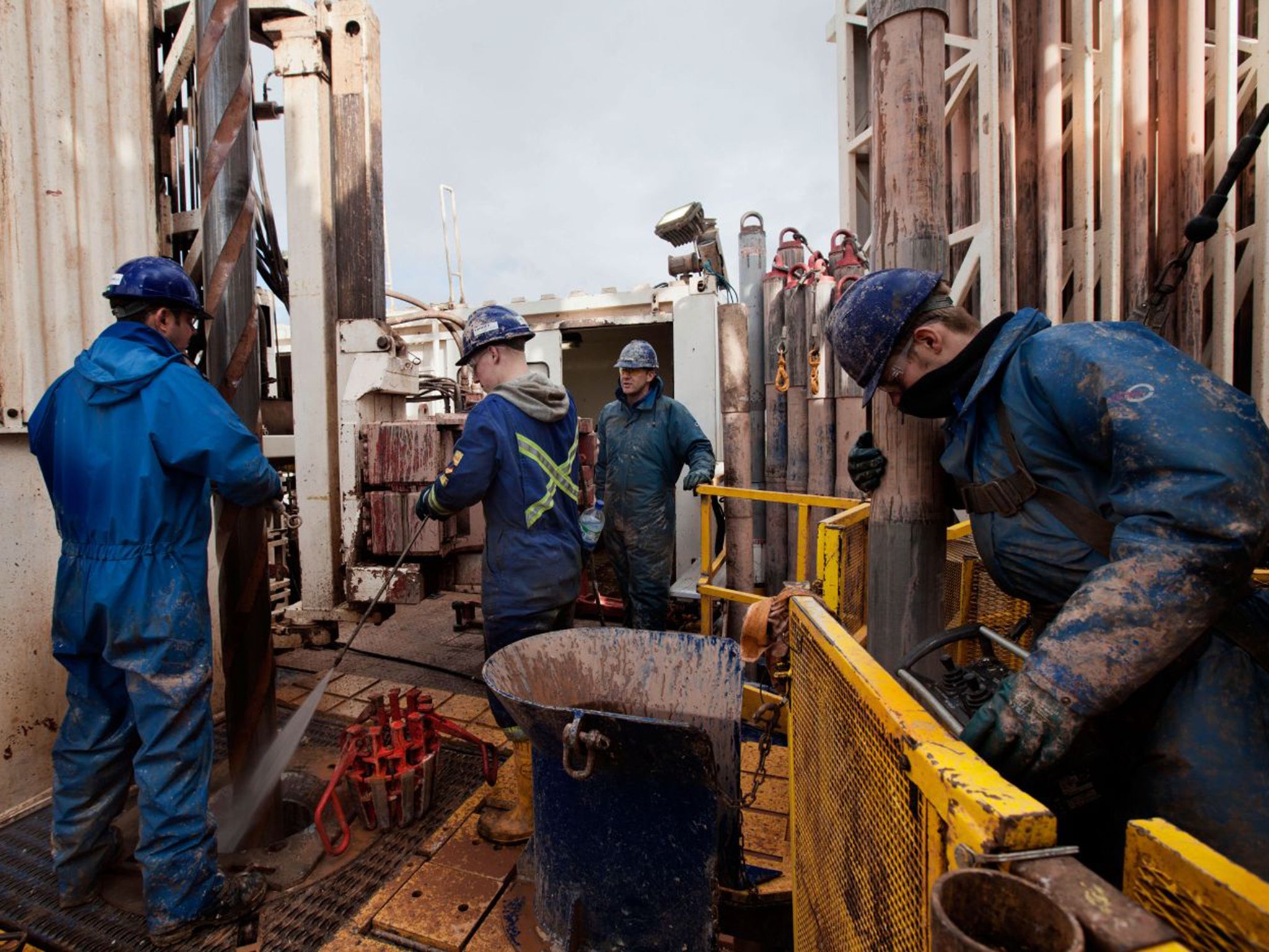 Engineers on a drilling platform extracting fossil fuels