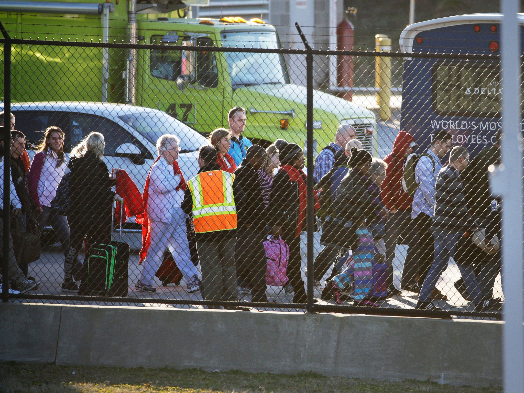 Passengers board a shuttle taking them from their planes at Hartsfield-Jackson Atlanta International Airport (AP)